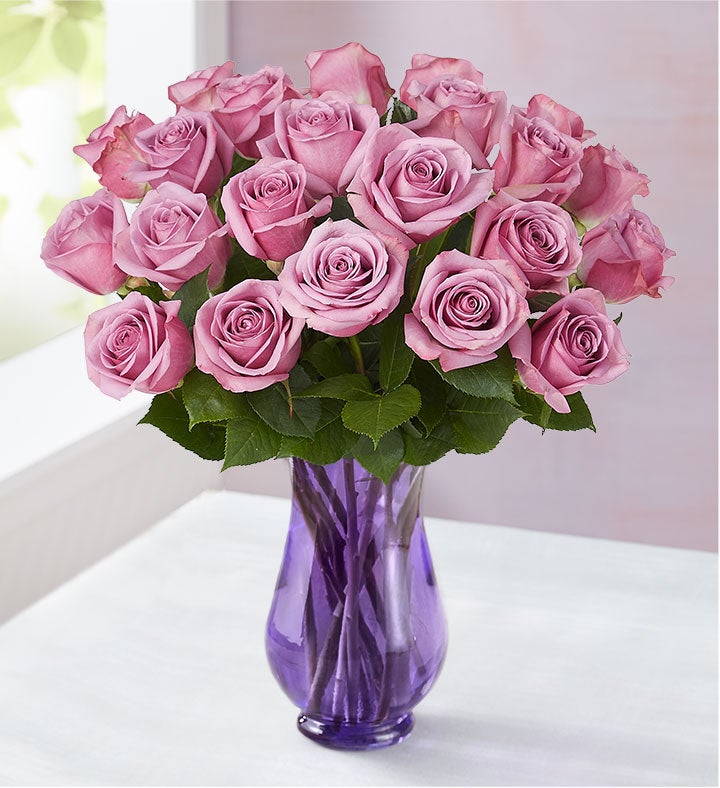 Two Dozen Purple Roses with Clear Tapered Vase